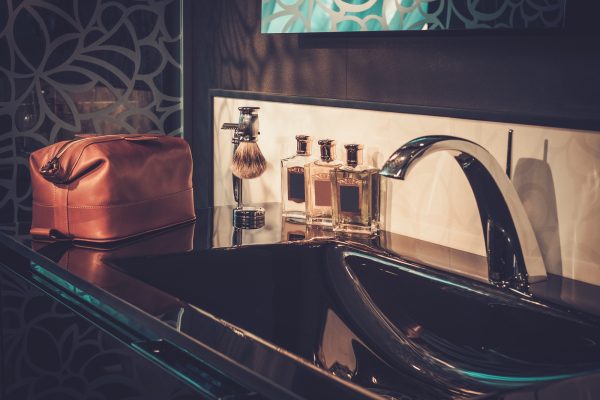 Gentleman's accessories in a luxury bathroom interior.
